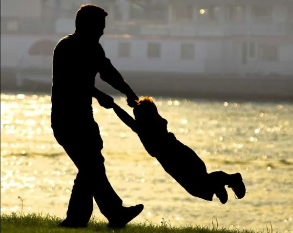 dad_twirling_son